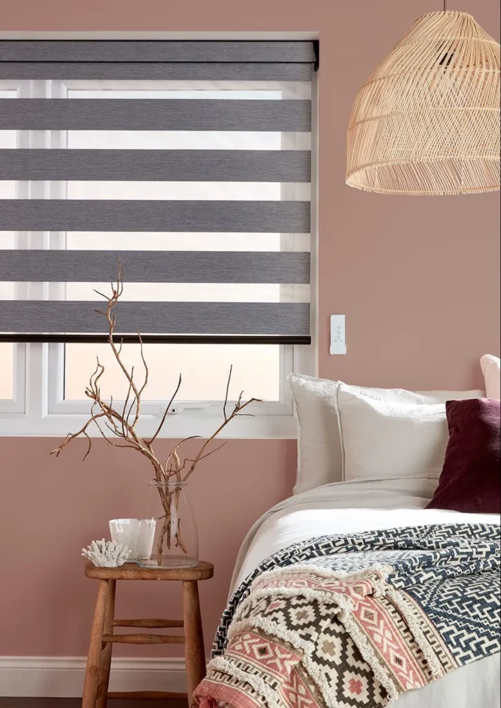 contact imeko blinds melbourne for a free in-home consultation - design consultant presenting fabric samples in a modern Melbourne living room with custom window furnishings