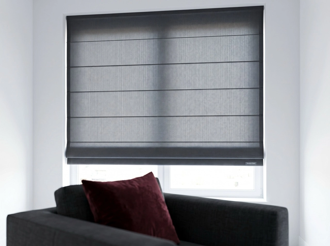 Roman Blinds 4 Modern roman blinds Melbourne in charcoal Texstyle Gala fabric with clean horizontal folds above a black sofa and burgundy cushion