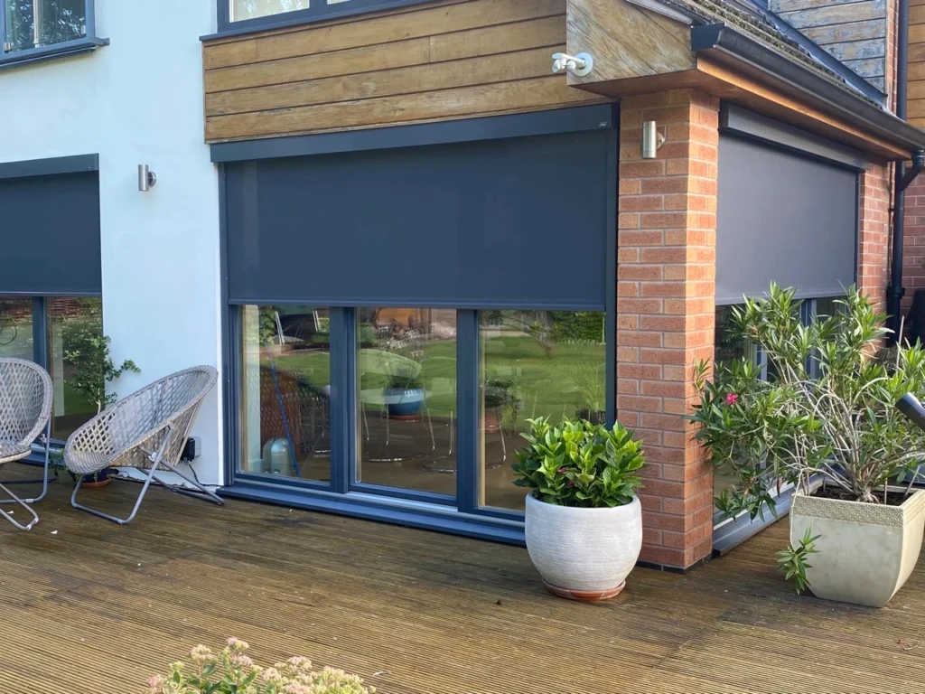 A modern Melbourne outdoor entertaining area enclosed on all sides with track-guided blinds creating an extra indoor-outdoor room.