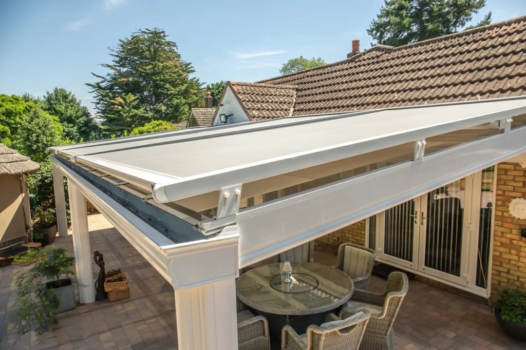 Close-up of a track-guided outdoor blind side channel mechanism showing the taut edge seal on a Melbourne patio frame.